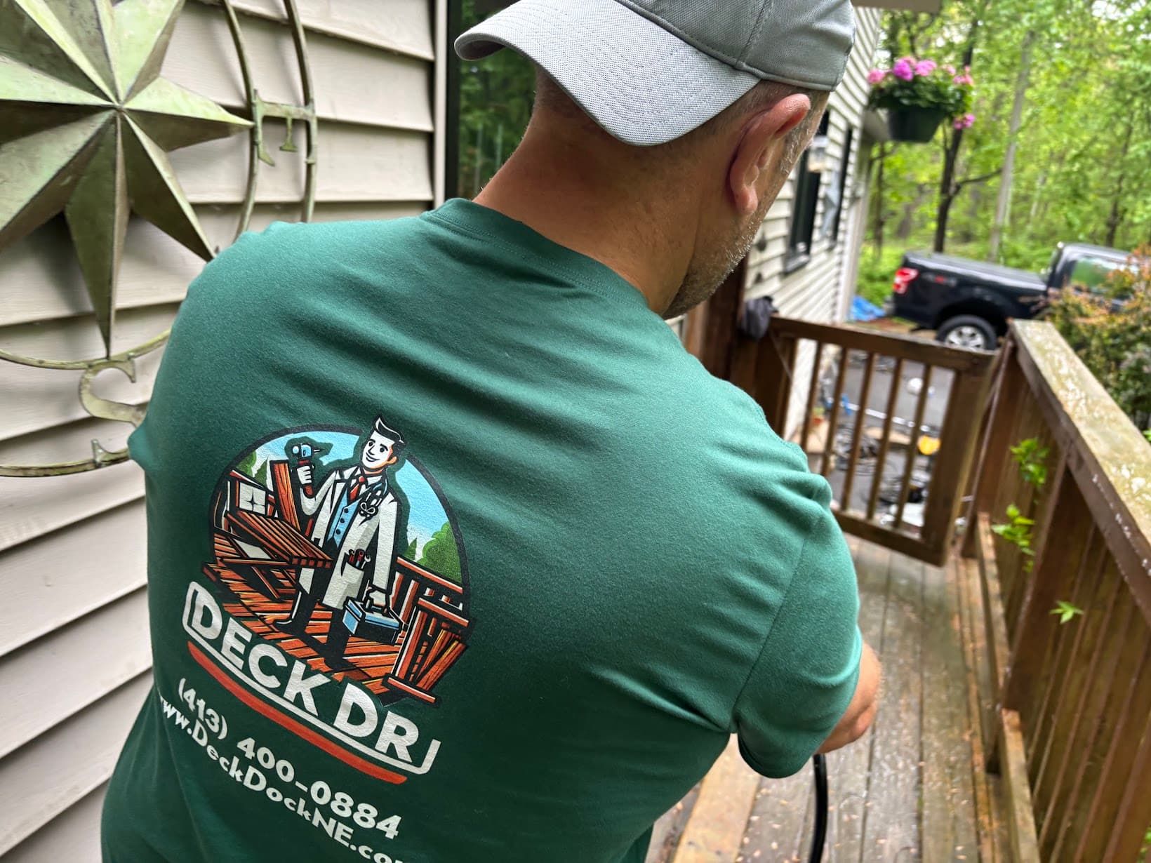 A Deck Doctors team member working on a deck restoration